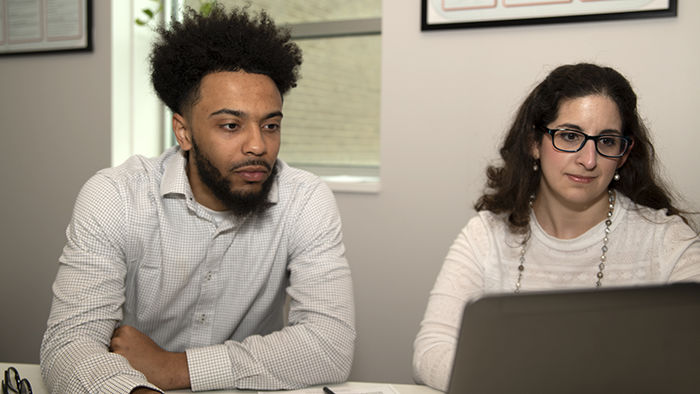 Jamar Dues (left) and Mary Budinsky (right) work together in a private tutoring room in the Student Success Center.