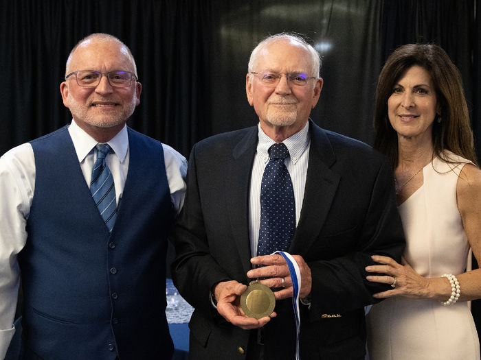 Award recipient Ronald M. Sheba posing with Dr. Charles Patrick and Paula Congelo.