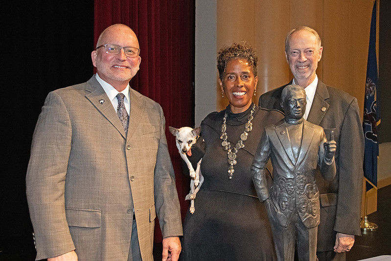 Charles Patrick, chancellor, with Vinnie Bagwell, sculptor, and Robert Eberly Jr., president of the Eberly Foundation