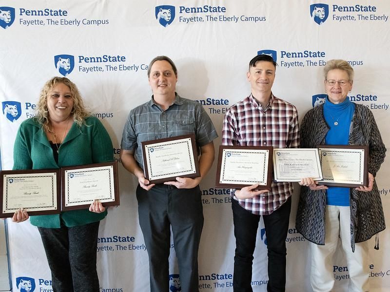 Brandy Burke, Nathaniel Bohna, Aris Karagiorgakis and Jo Ann Jankoski received excellence awards at the 2022 Faculty and Staff celebration.