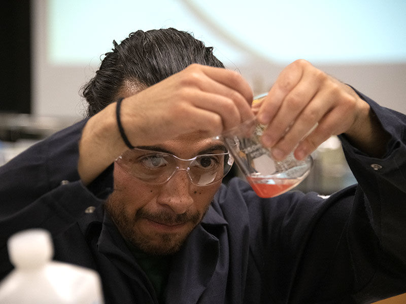 Chemistry professor working on an experiment. 