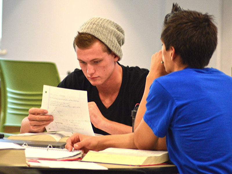 Two students studying in the student center.