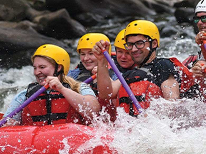 Students white water rafting.