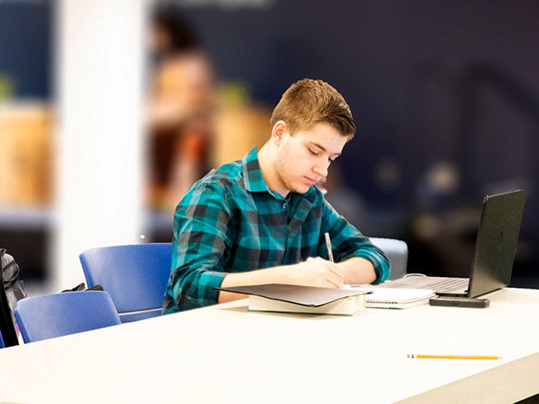 Student studying in the Student Center.