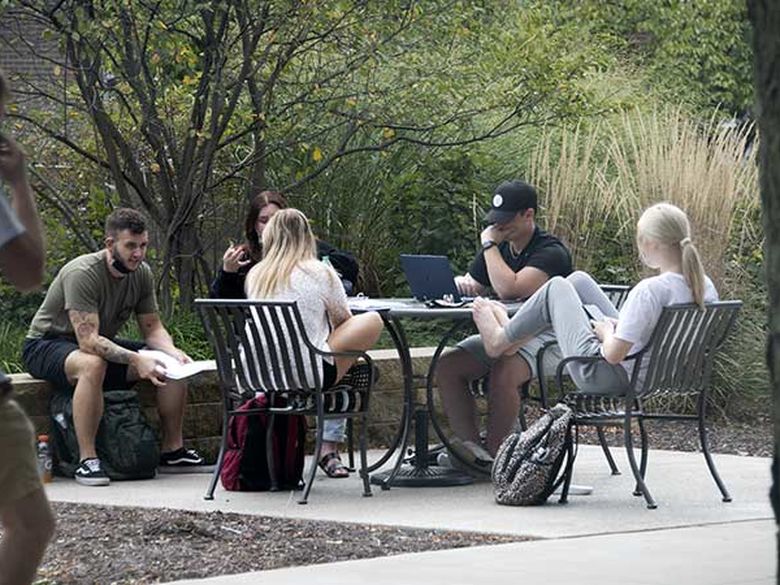 Student studying outside. 