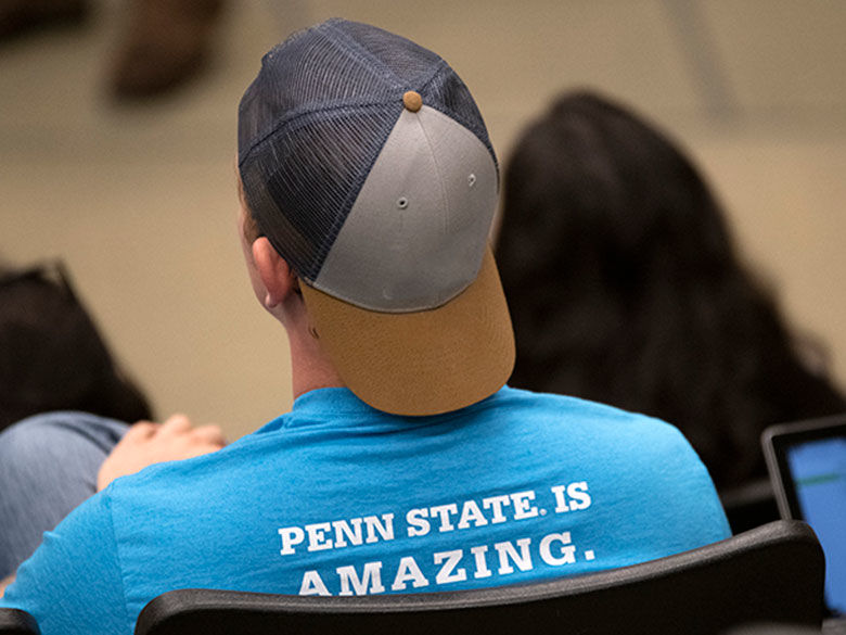 Student wearing a shirt saying Penn State is amazing.