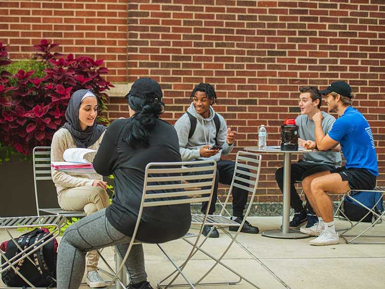 Students sitting outside.