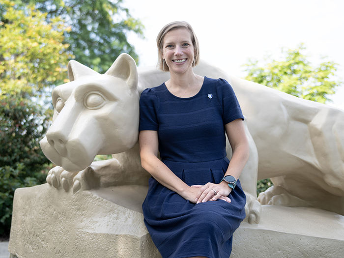 Megan Nagel sitting at the Lion Shrine. 