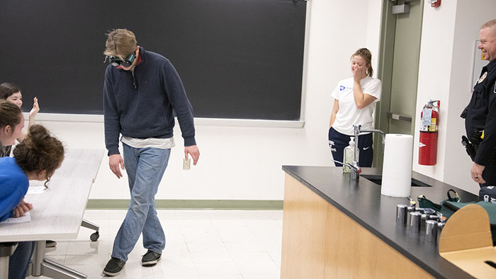 Students wear goggles that simulate the experience of being under the influence.