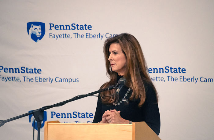 Paula Congelio, Vice President of Finance and Chief Financial Officer at West Virginia University, standing at the podium of Penn State Fayette’s 15th annual Scholarship Donor Dinner. 