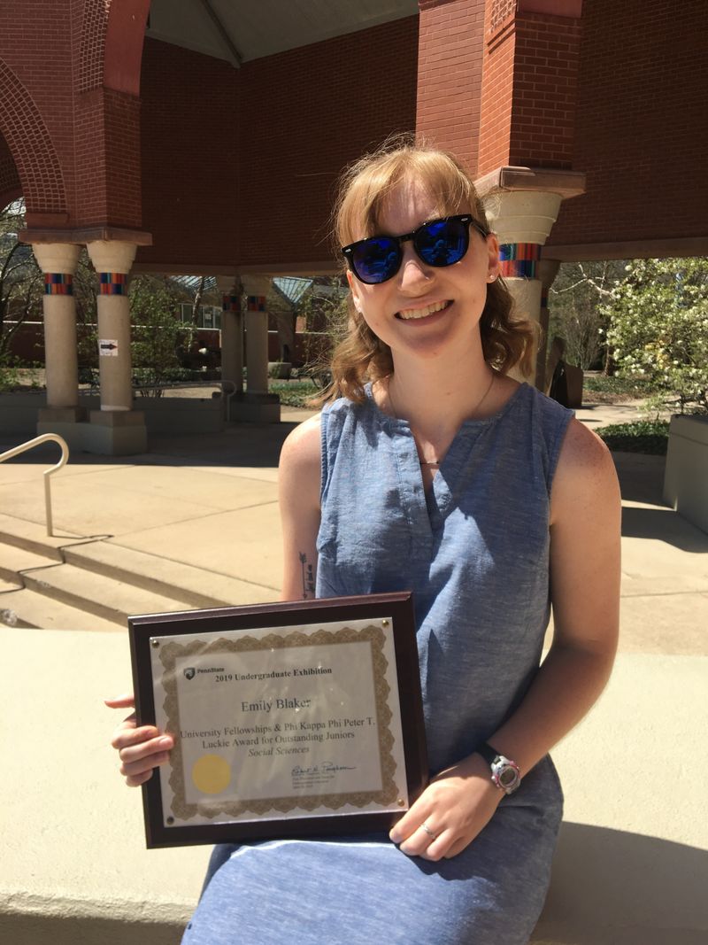 Emily Blaker receives award for Outstanding Juniors at the 2019 Undergraduate Research Exhibition.