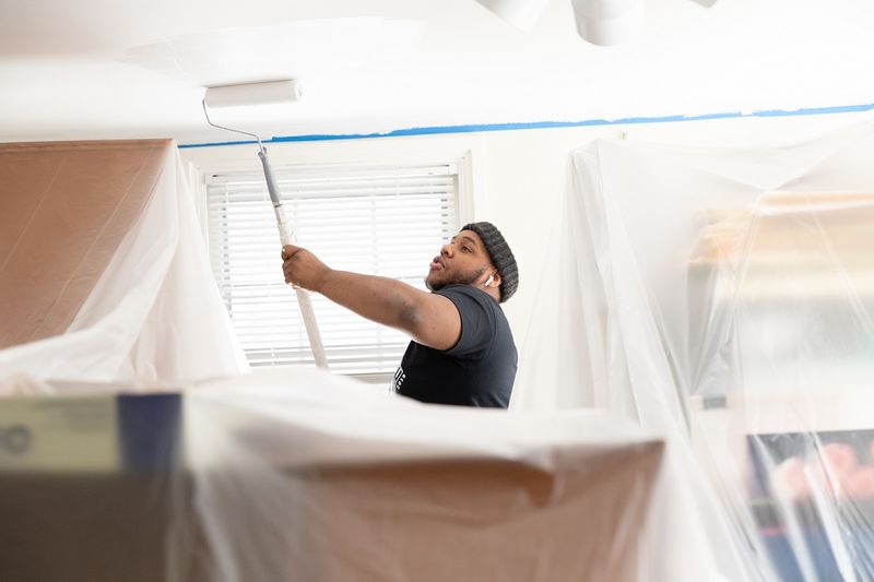 Student painting ceilings