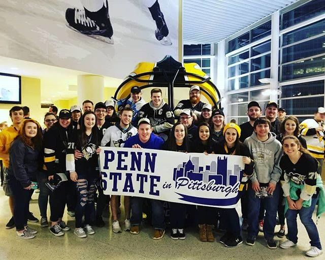 Students holding banner that reads "Penn State in Pittsburgh" Penn State students at Pittsburgh Penguins game