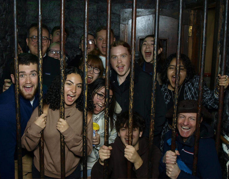 Students of the course CRIMJ 499: Serial Killers and European Criminal Justice posing at the Clink Jail.