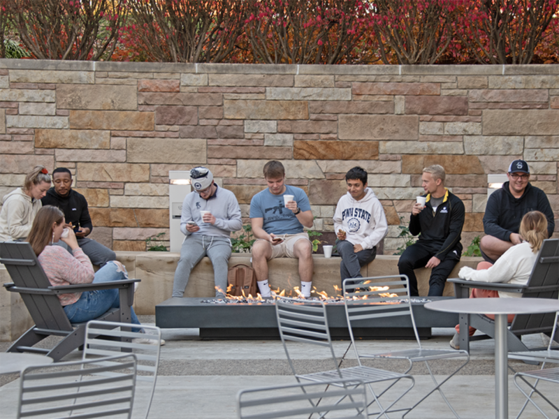 Students socialize at Outdoor Lounge dedication