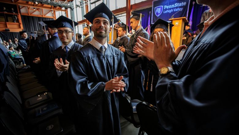 Students clapping at Commencement