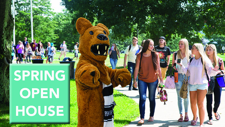 The Lion with students outside Eberly Building.