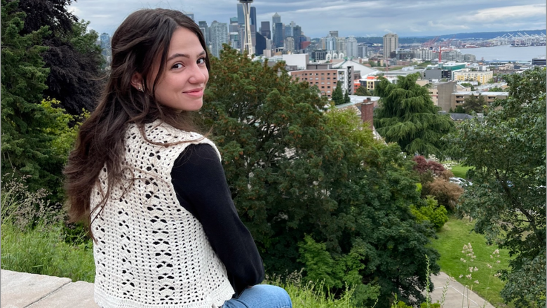 Josephine Pindro poses in front of the Seattle skyline.