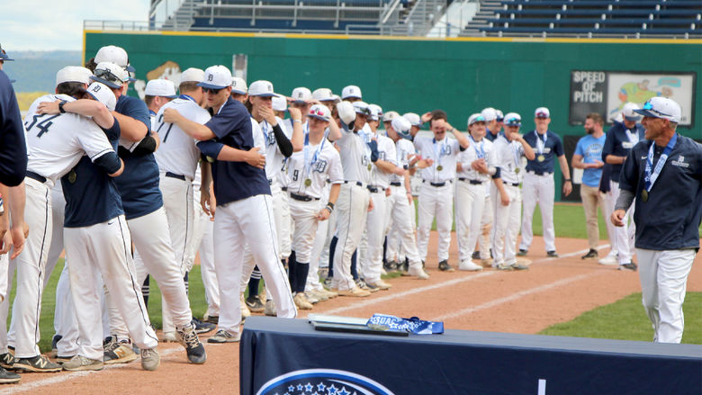 Penn State DuBois players and coaches congratulate one another after receiving their championship medals