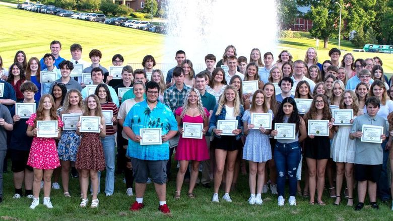 High school student recipients with their 4.0 Club certificates. 