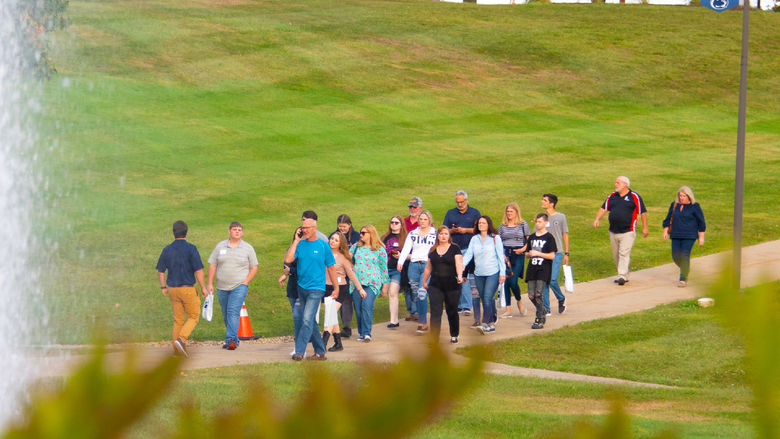 People walking across the Fayette campus.