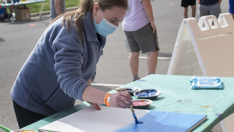 Maria Schultheis participates in the 'Pandemic Paint Party' event at 'Finally Unplugged' on April 23 at University Park.