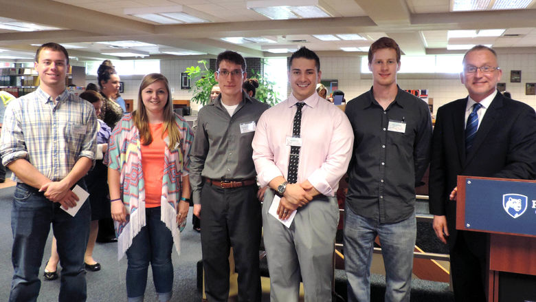 Winners of the spring Learning Fair at Penn State Fayette, The Eberly Campus are, from left: Robert Gunther, Zoey Budd, Adomas Povilianskas, Harry Barrett, Cody Lawrence, and Chancellor and Chief Academic Officer Dr. Charles Patrick.