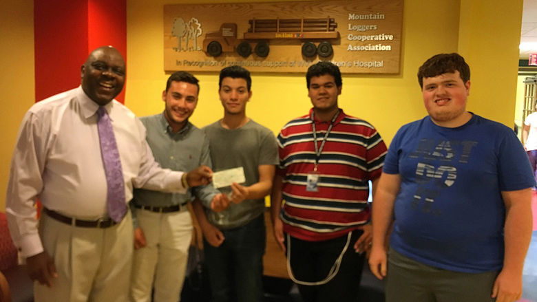 Pictured accepting the check, from left, is Bobby Nicholas of WVU Children’s Hospital, along with students David D’Antonio, Jose Morrero, Gabe Quiles, and Nick Fronzick.    
