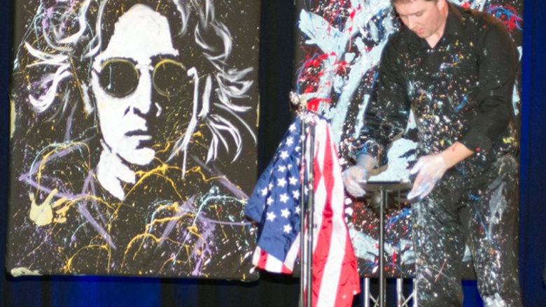 Tom Varano reveals his canvas of John Lennon at last fall’s 50th anniversary gala at Penn State Fayette, The Eberly Campus.