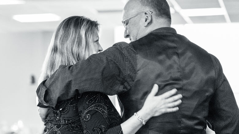 W. Charles Patrick and Billie Jo Yuhaniak hugging each other.