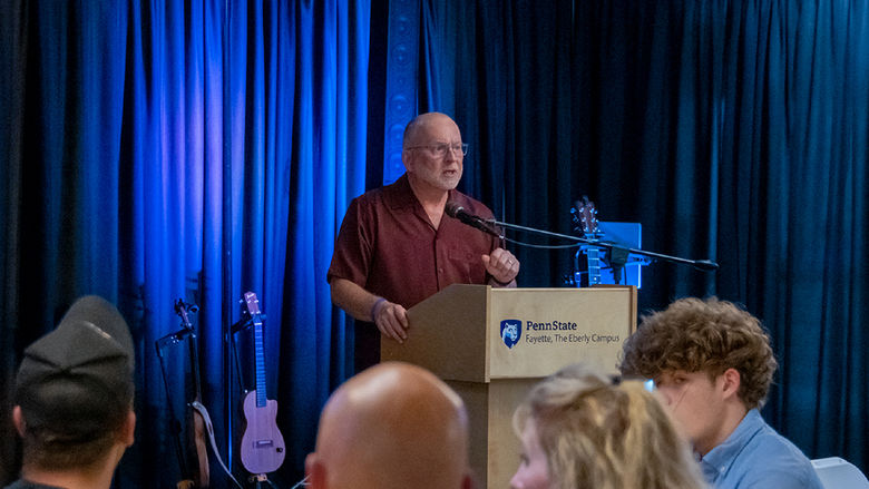 W. Charles Patrick delivering a speech after being recognized for his generosity.