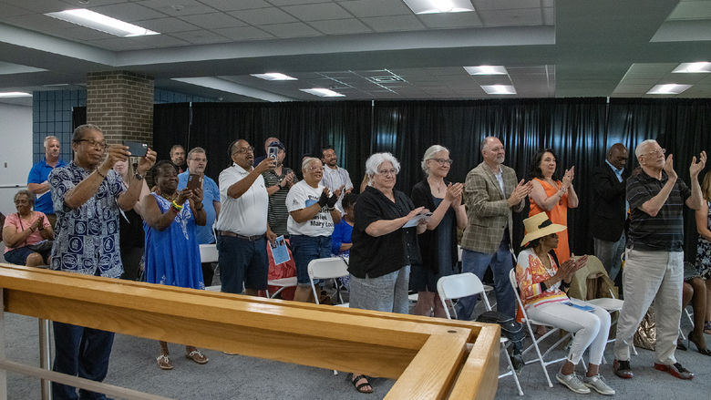 Attendees deliver a standing ovation to Rev. James Lawson Jr's message on unity.