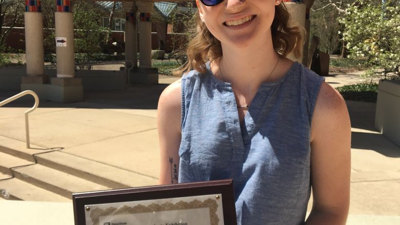 Emily Blaker receives award for Outstanding Juniors at the 2019 Undergraduate Research Exhibition.