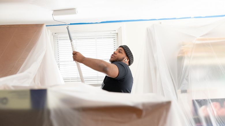 Student painting ceilings