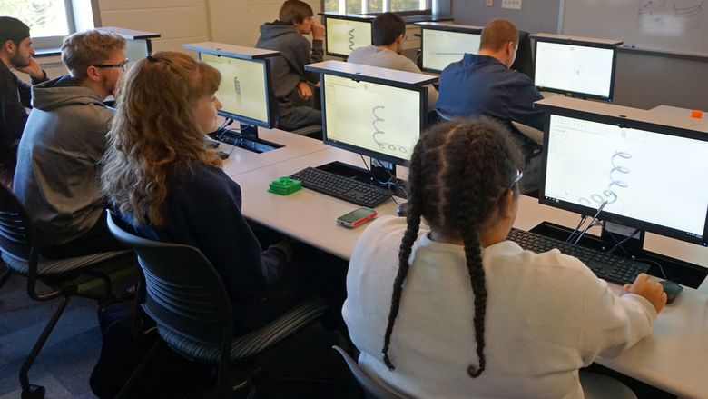 Students work on computers in lab