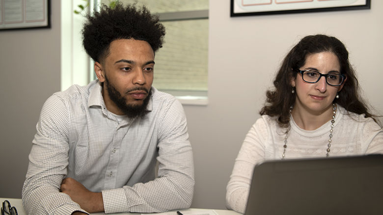 Jamar Dues (left) and Mary Budinsky (right) work together in a private tutoring room in the Student Success Center.