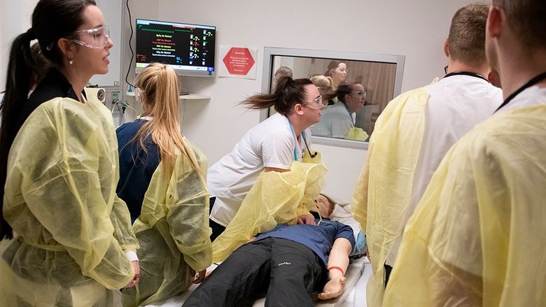 Students L-R  Morgan Dewitt, Jordan Pascoe, Caitlyn Stashick, Lucas Klorczyk, and Jonathan Klorczyk treat “Harry,” a simulated coded patient.