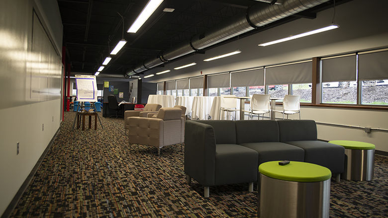 View of the couches and cubicles. 