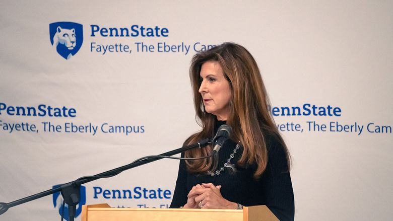 Paula Congelio, Vice President of Finance and Chief Financial Officer at West Virginia University, standing at the podium of Penn State Fayette’s 15th annual Scholarship Donor Dinner. 