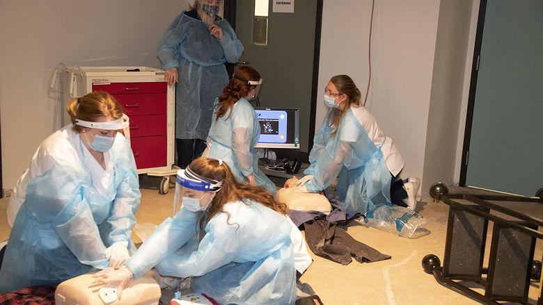 Four nursing students treat simulated patients in educational escape room