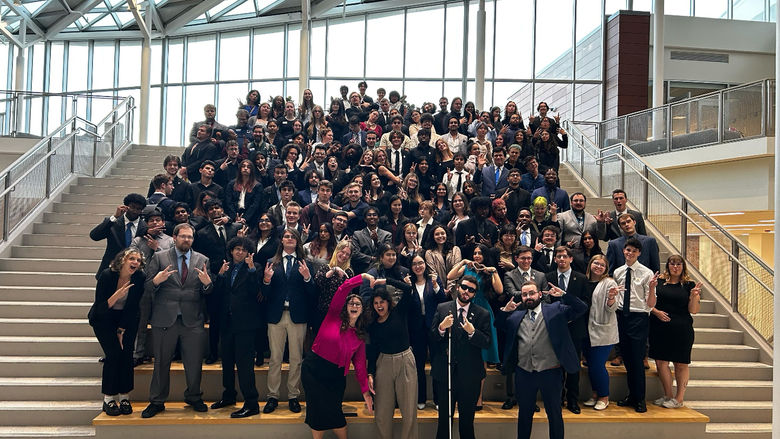 Joshua Krause stands with CCSG executives as council representatives gather in the background at the HUB-Robeson Center.