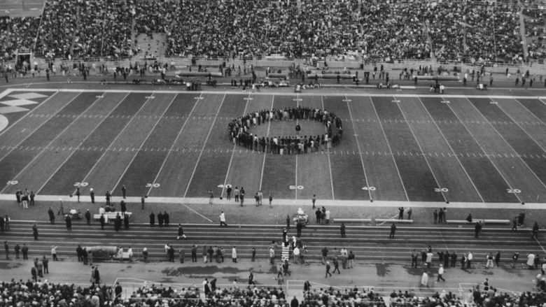 Black student protest on football field at halftime of 1969 football game