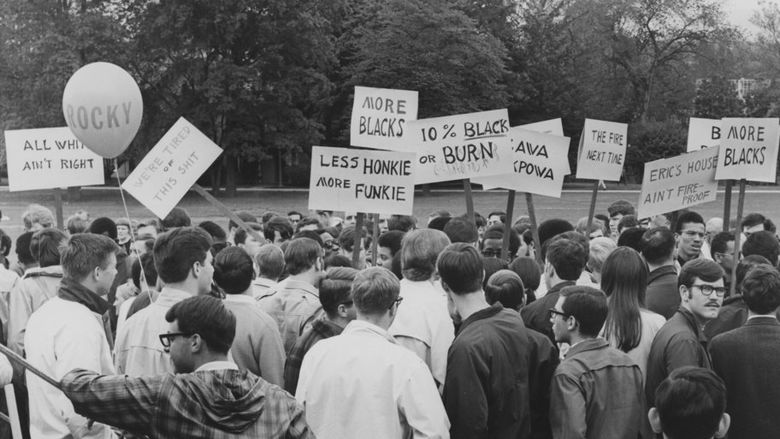 White observers surround black protesters on Old Main in 1968
