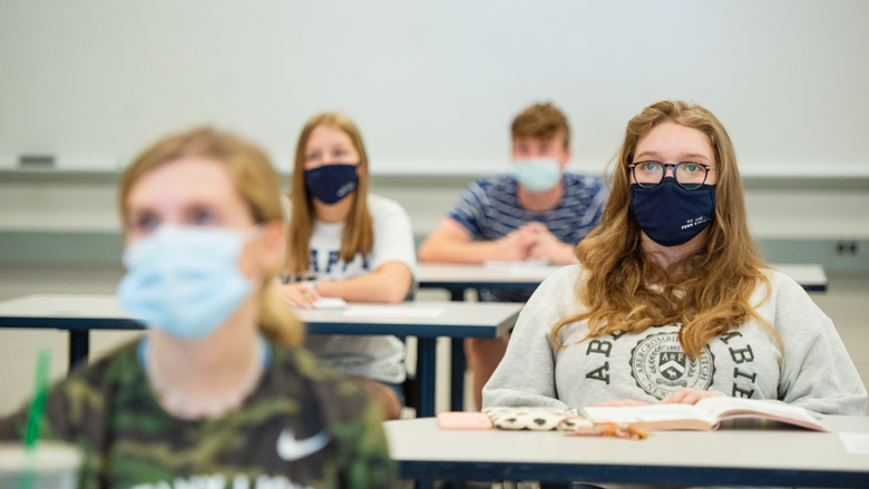Masked students in class