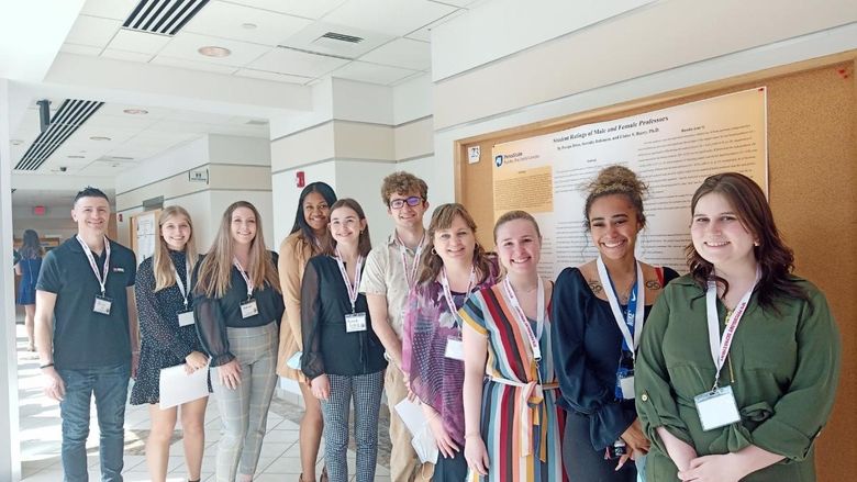 Aris Karagiorgakis, assistant teaching professor of psychology; students Ashley Stangroom, Kerstin Nutt, Pasepa Buwawa-Driso, Kenadi Erdely, and Tyler Miller; Elaine Barry, associate professor of human development and family studies; and students Adriana Gebe, Serenity Robinson, and Mary Byers.