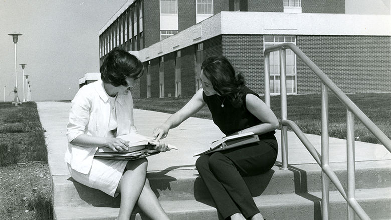 Two students in front of the Eberly Building