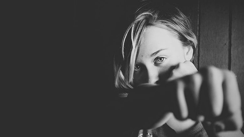 Woman showing a self-defense pose. 