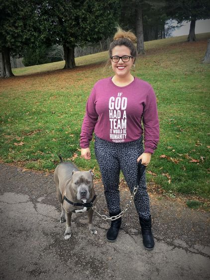 Malory Spring poses outside with her pitbull, Hoss