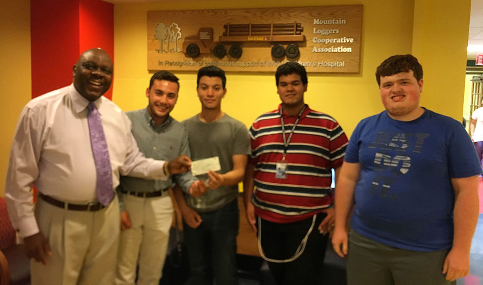 Pictured accepting the check, from left, is Bobby Nicholas of WVU Children’s Hospital, along with students David D’Antonio, Jose Morrero, Gabe Quiles, and Nick Fronzick.    