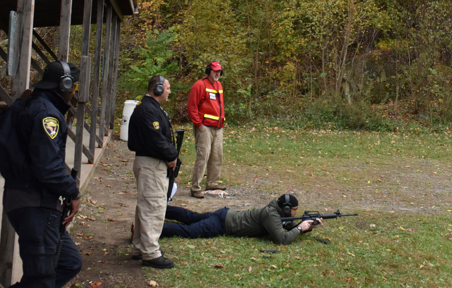 Constable Rocky Younkin (standing, right), an instructor with the CCPS, trains Wilkinsburg Police Officers Brandon Rourke, (laying), Doug Yuhouse (center), and William Coffee (left) to become certified as patrol rifle instructors.